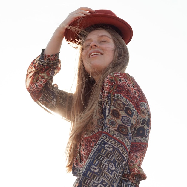 Low angle of bohemian woman posing with hat