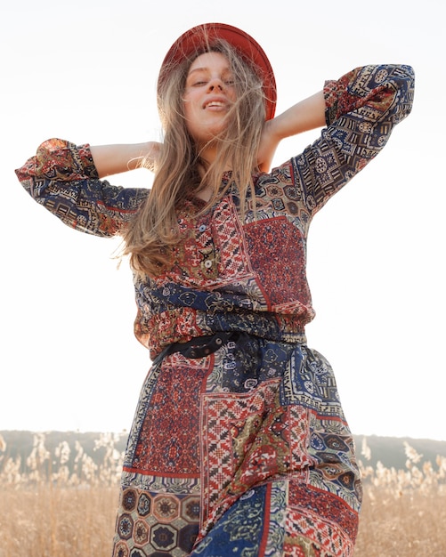 Low angle of bohemian woman posing