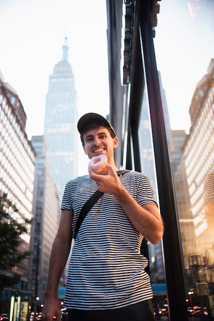 Low angle boy with doughnut