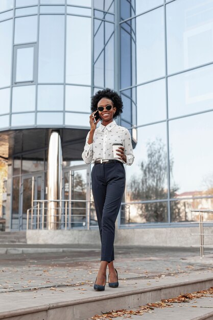 Low angle classy woman talking over phone