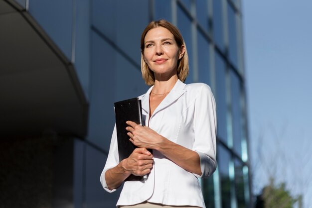 Low angle confident woman entrepreneur