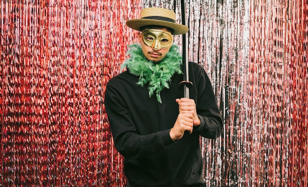 Low angle costumed male for carnival party