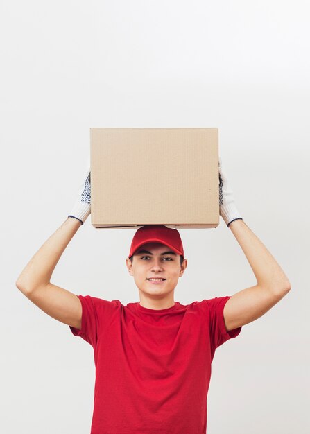 Free Photo low angle delivery man carrying package