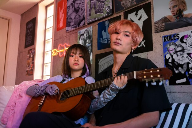 Low angle emo friends with guitar