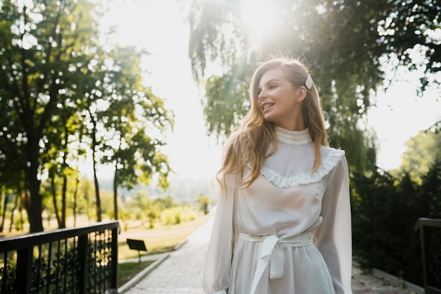 Free photo low angle fashionable birthday girl in park