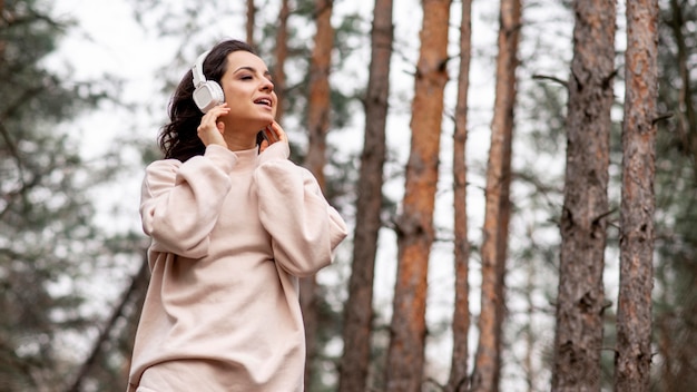 Low angle female with headphones