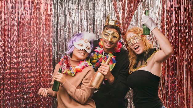 Low angle friends in costumes having fun