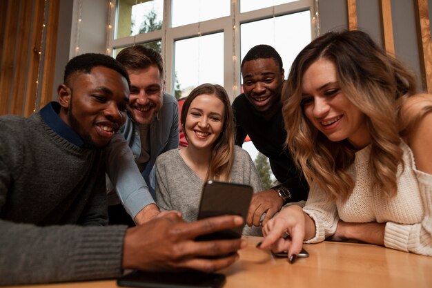 Low angle friends taking selfies