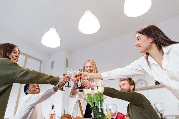 Low angle friends toasting