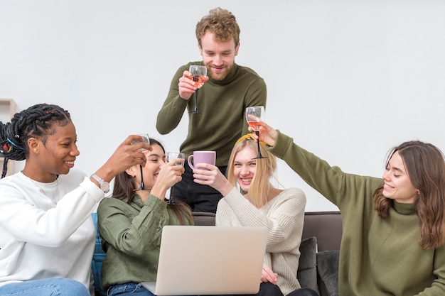 Free Photo low angle friends toasting