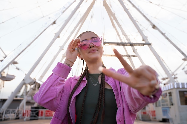 Free Photo low angle girl making hand gestures