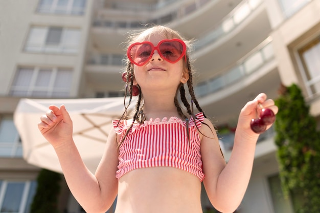 Low angle girl with cherries