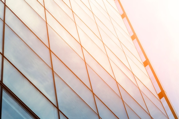 Free Photo low angle glass building with sunlight