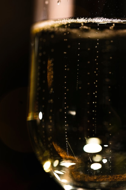 Free photo low angle glass with champagne almost full