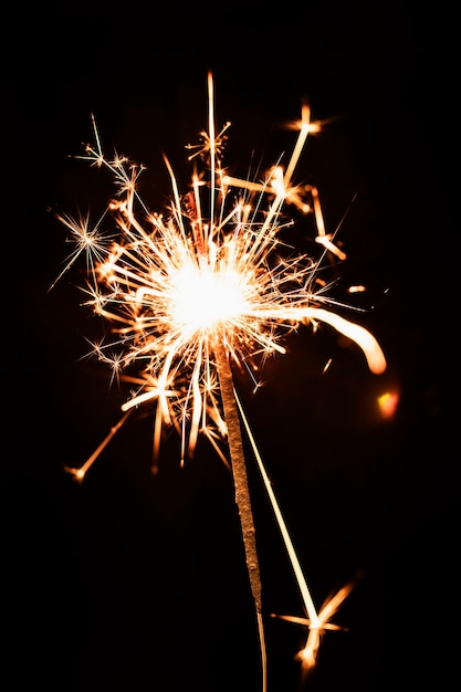 Low angle golden firework light on sky