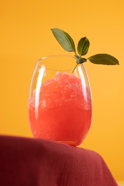 Free photo low angle granita dessert with leaves