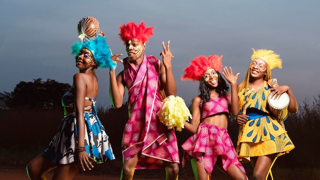 Low angle group of friends dressed for carnival