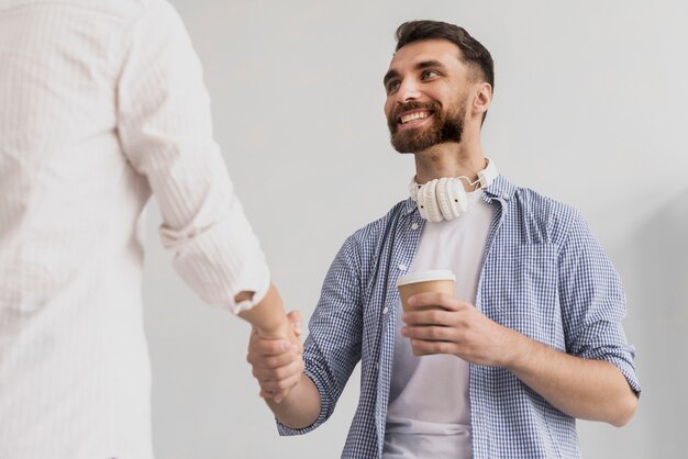 Low angle handshake at office view