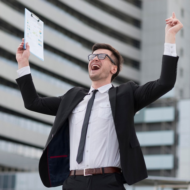 Low angle happy modern man