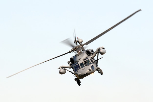 Free photo low angle isolated shot of a military hawk maneuvering