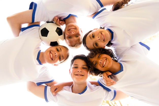 Low angle kids in sportswear looking down