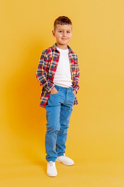 Low angle little boy posing