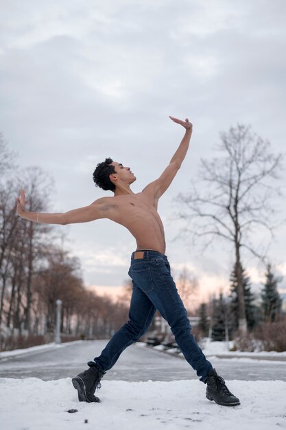 Low angle male dancing ballet outdoor