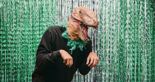 Low angle male in dinosaur costume