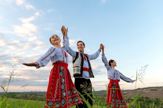 Free photo low angle man dancing with women