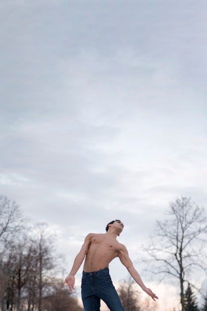 Low angle man performing ballet