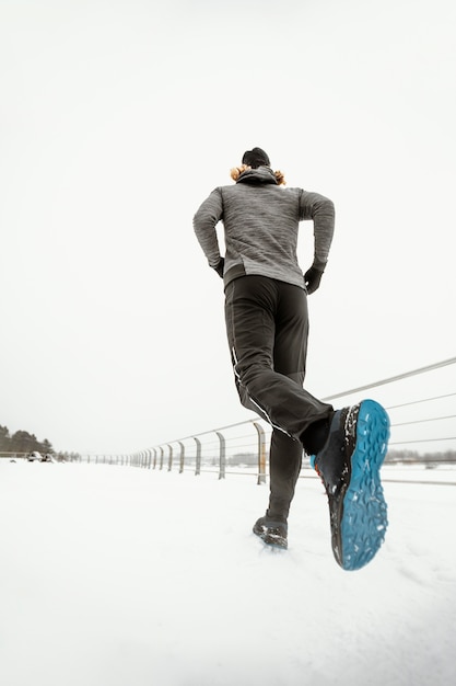 Free photo low angle man running outdoors