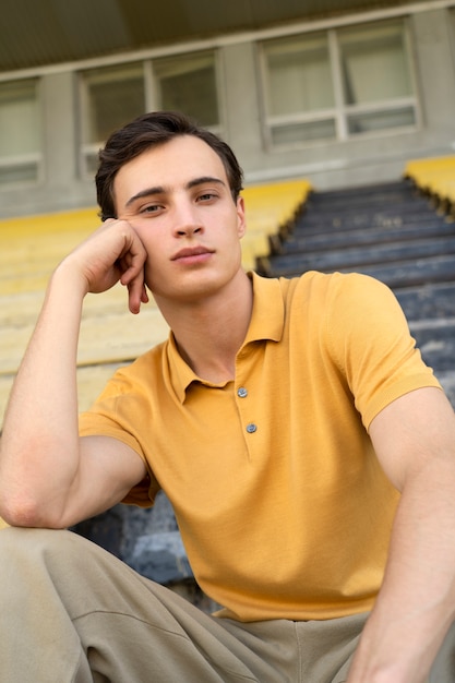 Free Photo low angle man sitting in grandstands