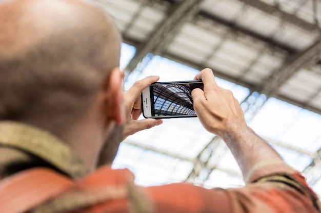 Free Photo low angle man traveling taking photos