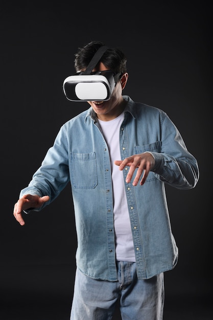 Free photo low angle man with virtual reality headset