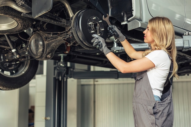 Low angle mechanical woman working