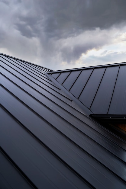 Low angle modern house roof and clouds