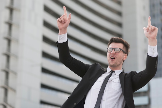 Low angle modern man pointing