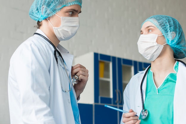 Low angle nurses talking