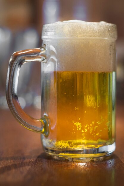 Low angle pint with beer on table