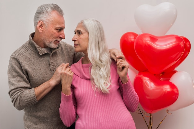 Free photo low angle senior couple looking at each other