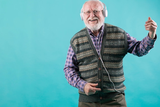 Low angle senior listening music