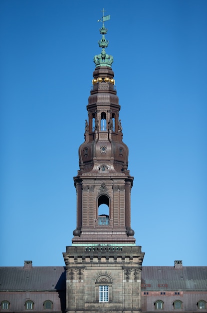 Free Photo low angle shot of the christiansborg palace tower on a clear sky