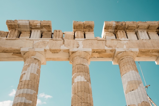 Low angle shot of the columns of the Acropolis Pantheon in Athens, Greece under the sky