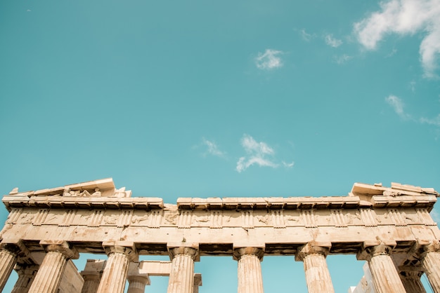 Free Photo low angle shot of the columns of the acropolis pantheon in athens, greece under the sky