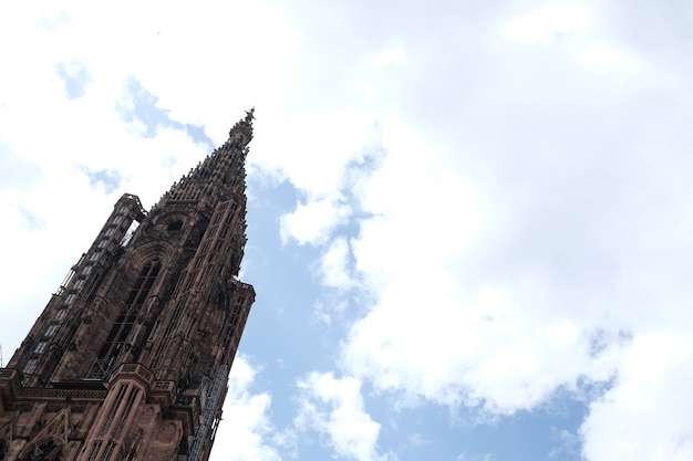 Free Photo low angle shot of the famous notre dame cathedral in strasbourg under a cloudy sky