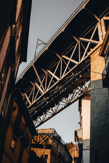 Free photo low angle shot of a gray concrete bridge in portugal