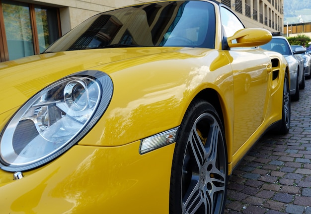 Free Photo low angle shot of the headlight of a modern car