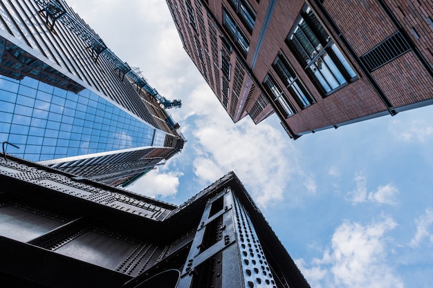 Free Photo low angle shot of high buildings with modern architecture patterns