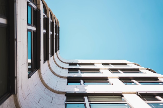 Low angle shot of a modern building with large glass windows