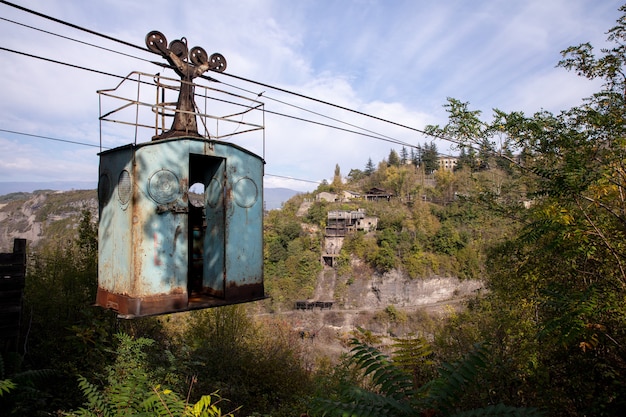 Free Photo low angle shot of an old abandoned ropeway in the middle of a mountainous scenery